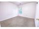 Small bedroom with neutral carpet and one window at 4350 Annlette Dr, Lawrenceville, GA 30044