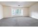Large, bright bedroom with neutral carpet and three windows at 4350 Annlette Dr, Lawrenceville, GA 30044