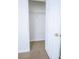 Organized closet with door, wire shelving, and neutral carpet providing ample storage space at 4350 Annlette Dr, Lawrenceville, GA 30044