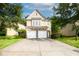 Charming two-story home with stone accents, a two-car garage, and a well-manicured lawn at 4350 Annlette Dr, Lawrenceville, GA 30044