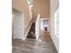 Bright foyer featuring hardwood floors, stairs with white railings, and neutral wall colors at 4350 Annlette Dr, Lawrenceville, GA 30044