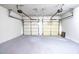 Spacious two-car garage with white walls and sealed concrete floors at 4350 Annlette Dr, Lawrenceville, GA 30044