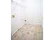 Functional laundry room with tile flooring, utility connections, and wire shelving for efficient organization at 4350 Annlette Dr, Lawrenceville, GA 30044