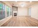 Spacious living room with hardwood floors, fireplace, bright windows, and a ceiling fan at 4350 Annlette Dr, Lawrenceville, GA 30044