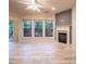 Living room with hardwood floors, a fireplace, large windows offering natural light, and neutral wall colors at 4350 Annlette Dr, Lawrenceville, GA 30044