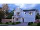Charming two-story home with a well-manicured lawn, complemented by a driveway, bushes and a tree at 511 Casanova Se St, Atlanta, GA 30315