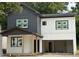 Modern two-story home with a contrasting gray and white exterior and an attached two-car garage at 511 Casanova Se St, Atlanta, GA 30315