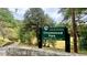 Entrance sign for Chosewood Park in Atlanta, surrounded by lush greenery and a stone wall at 511 Casanova Se St, Atlanta, GA 30315