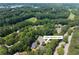Aerial view of property showing location in a lush, wooded neighborhood at 13995 Mariners Cv, Alpharetta, GA 30005
