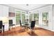 Charming breakfast nook with a glass table, many windows, and lovely natural light at 13995 Mariners Cv, Alpharetta, GA 30005