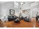 Bright living room with vaulted ceilings, hardwood floors, brick fireplace, and lots of natural light at 13995 Mariners Cv, Alpharetta, GA 30005