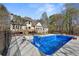Gorgeous backyard featuring a large swimming pool, beautiful home, and plenty of privacy at 2410 Glade Overlook, Cumming, GA 30041