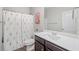 Bathroom featuring a vanity and shower with a floral curtain at 31 Village Trce, Rydal, GA 30171