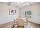 Elegant dining room features a coffered ceiling, wood floors, and ample natural light at 31 Village Trce, Rydal, GA 30171