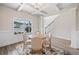 Elegant dining room features a coffered ceiling, wood floors, and ample natural light at 31 Village Trce, Rydal, GA 30171