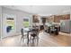 Open-concept kitchen with dining area, dark cabinets, and stainless steel appliances at 31 Village Trce, Rydal, GA 30171
