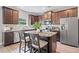 Modern kitchen features stainless steel appliances, a center island, and stylish cabinetry at 31 Village Trce, Rydal, GA 30171