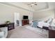 Relaxing main bedroom with tray ceilings, TV, and view to the ensuite bath at 31 Village Trce, Rydal, GA 30171