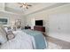 Comfortable main bedroom featuring a tray ceiling, plush carpet, and ample natural light at 31 Village Trce, Rydal, GA 30171