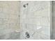 Luxury shower featuring marble-look tile and high-end fixtures at 31 Village Trce, Rydal, GA 30171