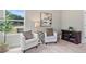 Cozy sitting area with a window overlooking the backyard, neutral paint and decor at 31 Village Trce, Rydal, GA 30171