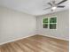Cozy bedroom featuring a ceiling fan, large window, and neutral carpet at 3135 Journal Ct, Decatur, GA 30035
