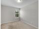 Cozy bedroom featuring neutral carpet and a large window that brings in lots of natural light at 3135 Journal Ct, Decatur, GA 30035