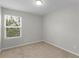 Bright bedroom featuring neutral carpet and a large window that brings in lots of natural light at 3135 Journal Ct, Decatur, GA 30035