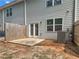 Back exterior view of the property with a fenced patio area at 3135 Journal Ct, Decatur, GA 30035