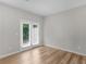 Inviting living space with access to the outdoors, features wood-look flooring and neutral walls creating a serene atmosphere at 3135 Journal Ct, Decatur, GA 30035