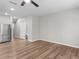 Bright, open-plan room with wood-look floors that leads to other rooms in this lovely home at 3135 Journal Ct, Decatur, GA 30035