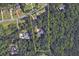 Aerial view of the home and property, highlighting its secluded location surrounded by lush greenery and trees at 6865 Cowan Mill Rd, Winston, GA 30187