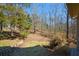 Secluded backyard with trees and greenery for nature enthusiasts and those seeking privacy at 6865 Cowan Mill Rd, Winston, GA 30187