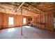 Unfinished basement with exposed insulation, wood framing, and concrete floor, full of possibilities at 6865 Cowan Mill Rd, Winston, GA 30187