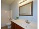 Cozy bathroom with decorative vanity, shower, and toilet at 6865 Cowan Mill Rd, Winston, GA 30187