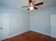 This bedroom features a ceiling fan and closet at 6865 Cowan Mill Rd, Winston, GA 30187