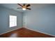 This bedroom offers great natural light, a ceiling fan, and closet at 6865 Cowan Mill Rd, Winston, GA 30187