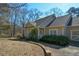 Charming home with a covered porch and manicured landscaping offers great curb appeal at 6865 Cowan Mill Rd, Winston, GA 30187