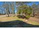 Well-manicured front yard with stone retaining wall is ready for its new owners at 6865 Cowan Mill Rd, Winston, GA 30187