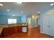 Bright open concept kitchen with wood floors and ample cabinet storage at 6865 Cowan Mill Rd, Winston, GA 30187