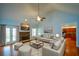 Open-concept living room featuring hardwood floors, a fireplace, and ample seating at 6865 Cowan Mill Rd, Winston, GA 30187