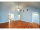 Open living area featuring hardwood floors, high ceilings, and multiple entryways at 6865 Cowan Mill Rd, Winston, GA 30187