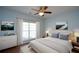 A serene main bedroom boasts a king bed, a scenic view, and calming decor at 6865 Cowan Mill Rd, Winston, GA 30187