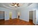 Light-filled main bedroom with hardwood floors and access to walk-in closet at 6865 Cowan Mill Rd, Winston, GA 30187