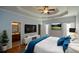 Spacious main bedroom boasts tray ceiling, hardwood floors, en-suite bath, and ample natural light at 6865 Cowan Mill Rd, Winston, GA 30187