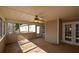 Sunroom with paneled walls and ceiling, ceiling fan, and outdoor views offering a retreat at 6865 Cowan Mill Rd, Winston, GA 30187