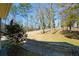 Beautiful yard with trees and natural landscaping is ready for its new owners at 6865 Cowan Mill Rd, Winston, GA 30187