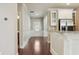 An open kitchen space featuring stainless steel appliances, granite countertops, and white cabinetry at 2638 Lake Manor Cir, Duluth, GA 30096