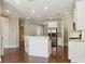 Spacious kitchen with a breakfast bar, stainless steel appliances and access to a walk-in pantry and hallway at 2638 Lake Manor Cir, Duluth, GA 30096