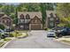Charming two-story home with brick and siding exterior, complemented by well-maintained landscaping in a suburban neighborhood at 2638 Lake Manor Cir, Duluth, GA 30096